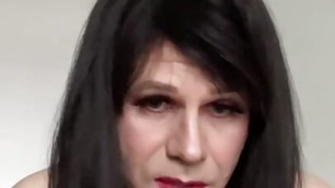Trans woman sucking on dildo