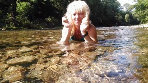 Sexy t-girl swimming in mountain river and wetting teal summer dress ...